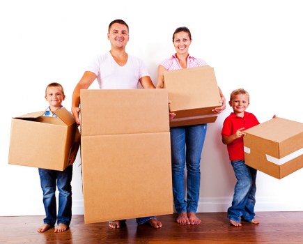 Packed boxes and furniture being loaded into a van for an Islington relocation