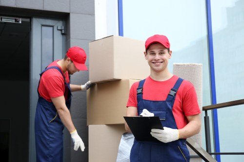 Furniture removals team handling items in an Islington residential move