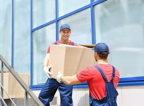 Commercial moving vehicles and equipment prepared for an Islington business relocation