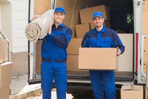 Assorted sturdy cardboard boxes and wrapping materials for a local move