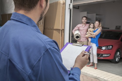 Removal van and moving team working on a residential street in Islington