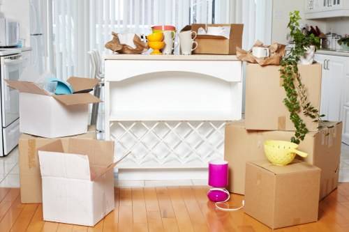 Prepared moving boxes and furniture ready for transport during an Islington removal