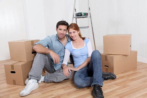 Packed moving boxes and furniture ready for a house move in Islington